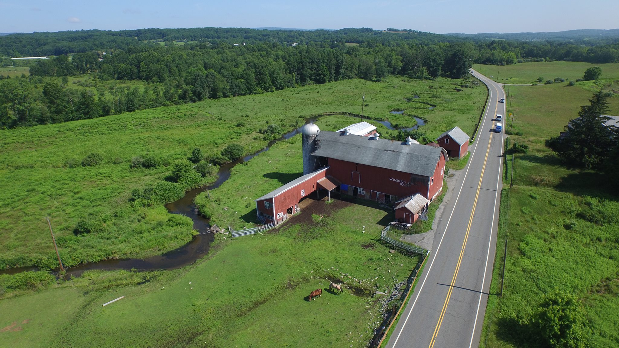 Aerial drone view of Winding Brook Farm along Papakating Creek in Sussex County, New Jersey