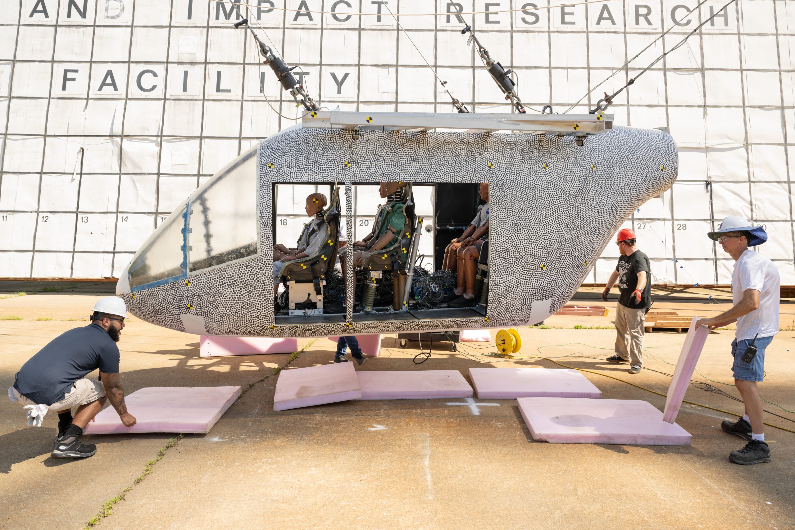 NASA researchers prepare an eVTOL test article for impact research